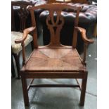 A Georgian mahogany commode chair, with rush seat and ceramic chamber pot, on square section legs