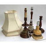 Three turned oak table lamps; together with one other; together with a pair of lampshades