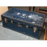 A large blue travel trunk with metal bracing, the top marked 'E.C.R. Clive', 92cmW