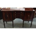 A reproduction sideboard, three drawers flanked by two cupboard doors, 137cmW