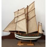 A small model ship, 39cmL including bowsprit, with plaque reading Bisquine