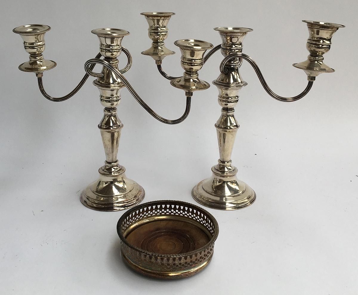 A pair of three arm silver plated candlesticks, each 28cmH