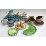 A quantity of Poole Pottery to include plates, cups, saucers, jug; together with several pieces of