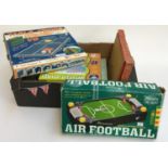 A box of toys to include Air Football, mini table tennis, a Merit chemistry set, etc
