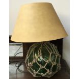 A green glass table lamp in the form of a fisherman's float, with shade, height to top of shade