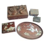 A carved Oriental wooden trinket box depicting a dragons with glass eye detail, 28x18x9.5cm;