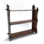 A Victorian oak hanging set of three shelves with pierced sides, 52.5cmW