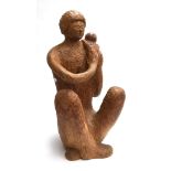 A large carved figure of a seated man with child