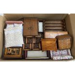 A box of dolls house furniture to include double bed, wardrobe, set of four chairs and table,