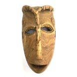 A wooden hardwood carved tribal mask, purchased by the vendor in 1952, 31cmH
