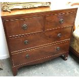 A small 19th century oak and mahogany chest of two short over two long cockbeaded drawers,