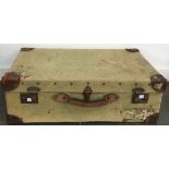 A vintage canvas covered suitcase, with leather corners, 70cmW