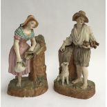 A pair of porcelain figures, a young boy holding a nest, 28.5, together with a young girl at a