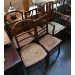 Four various caned occasional chairs; together with an Edwardian open armchair