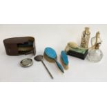 A small lot of dressing table items to include a pair of gent's clothes brushes in leather case; two