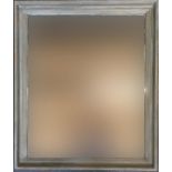 A large wall mirror with distressed green and gilt frame, 90x77cm