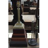 A brass table lamp in the form of a Corinthian column on large stepped plinth base, 38cmH;