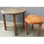 An Islamic circular table with folding base, 59cmD; together with a small marquetry table, 41cmD