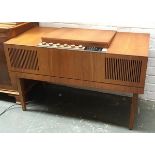 A Mid-century HMV radiogram, with stereo radio and BSR turntable, with spare stylus, 96cmW