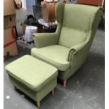 A pair of contemporary wingback armchairs, each with matching footstool