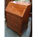 A good reproduction bureau by Brights of Nettlebed, featherbanded, fall front over four drawers,