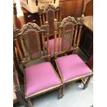 A set of three oak dining chairs with carved top rail, caned back, drop in seats, on turned legs