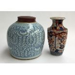 An imari vase, 24.5cmH; together with a large blue and white Oriental jar with lid