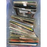 A box of vinyl singles to include Lionel Richie, Michael Jackson, Meatloaf, Modern Romance, Mike