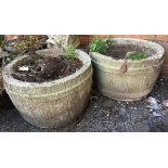 A pair of composite stone planters, in the form of barrels, 43cmD, 28cmH