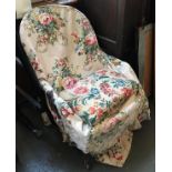 A small bedroom chair, on turned legs and casters, in need of some restoration