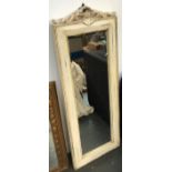 A white painted carved wood mirror with pierced shell cresting, 98x35.5cm