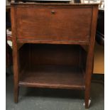 A early 20th century oak side table with fall front cupboard over undershelf, 59x37x77cmH