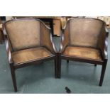 A pair of reproduction bergere armchairs, double caned, with cushions
