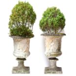 A pair of large garden urns depicting Roman scenes, on square plinth bases, 100cm high