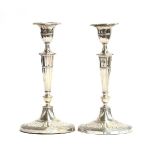 A pair of silver candlesticks by William Hutton & Sons Ltd, London 1908, in the Adam style, having