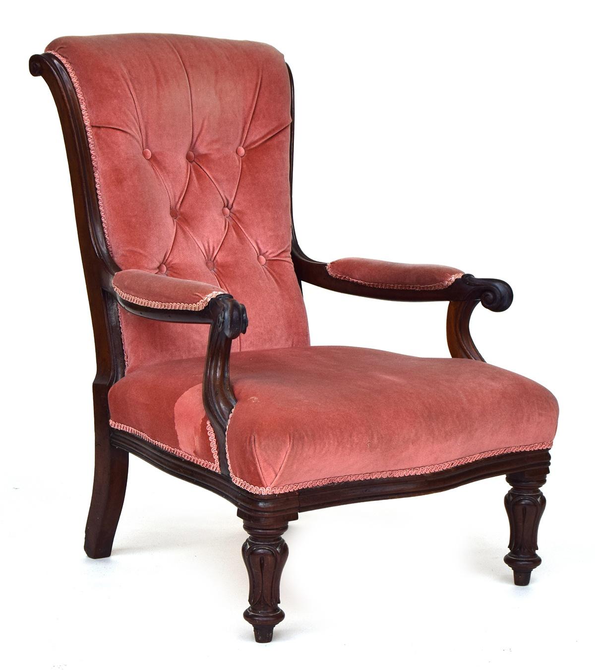 A 19th century button back open armchair, scrolling arms, on carved front legs