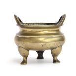 A Chinese brass censer with twin loop handles, with Xuande seal to base, 16.5cm high, approx. 2.5kg