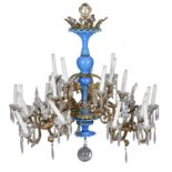 A probably Italian gilt metal and blue glass twenty four light chandelier, 20th century, the scallop