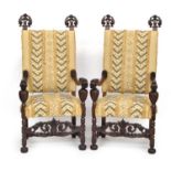 A pair of mid-19th century carved Italian open armchairs, upholstered seats and backs, scrolling