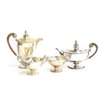 A four piece silver teaset by Goldsmiths & Silversmiths Co., London 1911, comprising coffee pot,