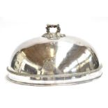 A very large silver plated meat cloche with armorial crest bearing motto 'Omnia Pro Bono Tendit Ad