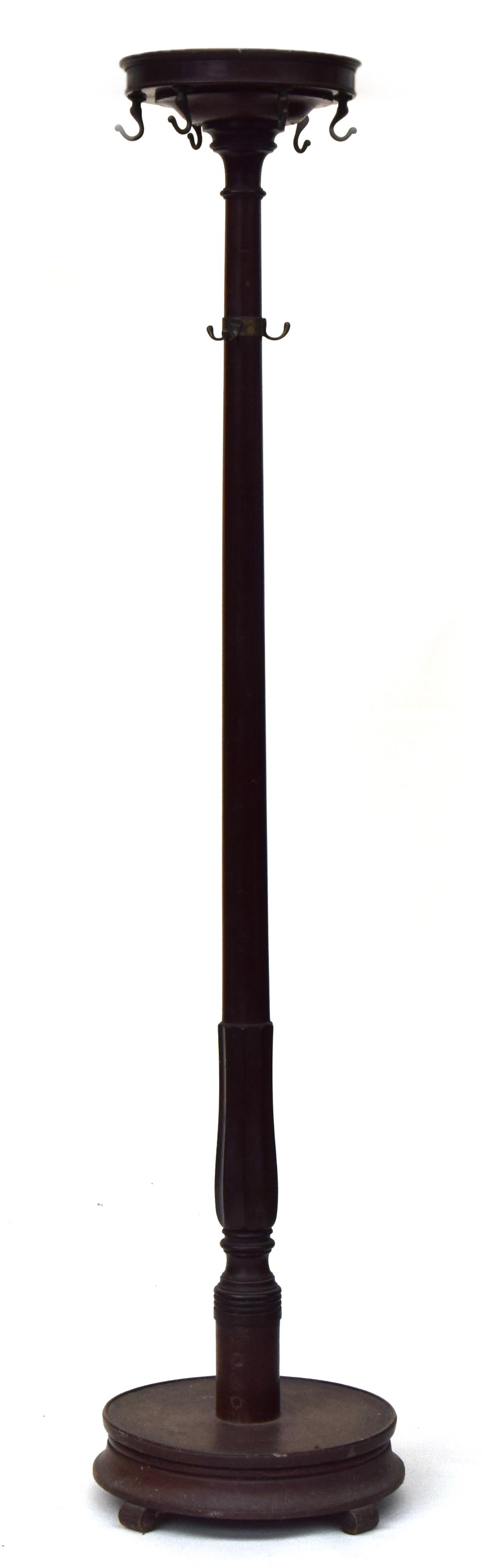 An early 20th century mahogany coat stand with brass fittings, 178cm high