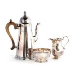 A modern three piece silver coffee set, by Roberts & Belk, Sheffield, 1973, in Queen Anne style, the