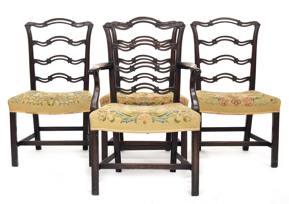 A good set of four Georgian dining chairs, one a carver, carved pierced rails, stuffover seats, on