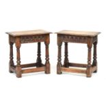 A pair of oak joint stools, each with moulded top over carved apron, block turned legs on square