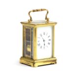 A French gilt metal carriage clock, Roman numerals to enamel dial, with key, 11.5cm high