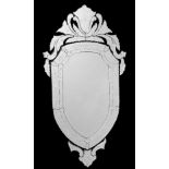 A Venetian shield shaped wall mirror, 20th century, with etched decoration, 138cm high, 72cm wide;