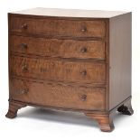 A small 20th century Heal's bow front mahogany chest of four graduating cockbeaded drawers, on swept
