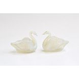A pair of Burtles and Tate pressed opalescent glass swans, reg no. 20086, each 9cm high