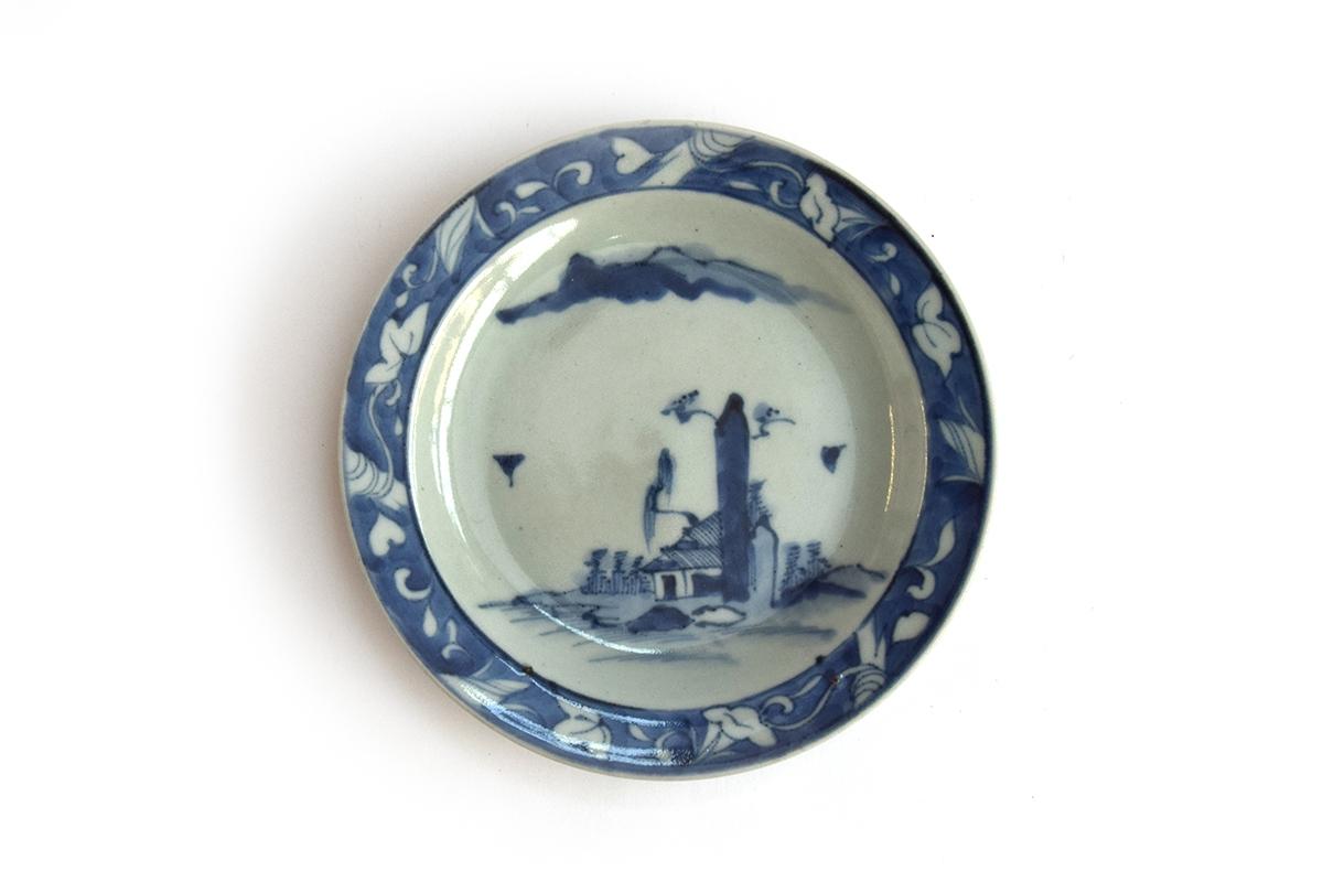 A Japanese blue and white Arita ware plate depicting, Edo period, marked to base, 17cm diameter